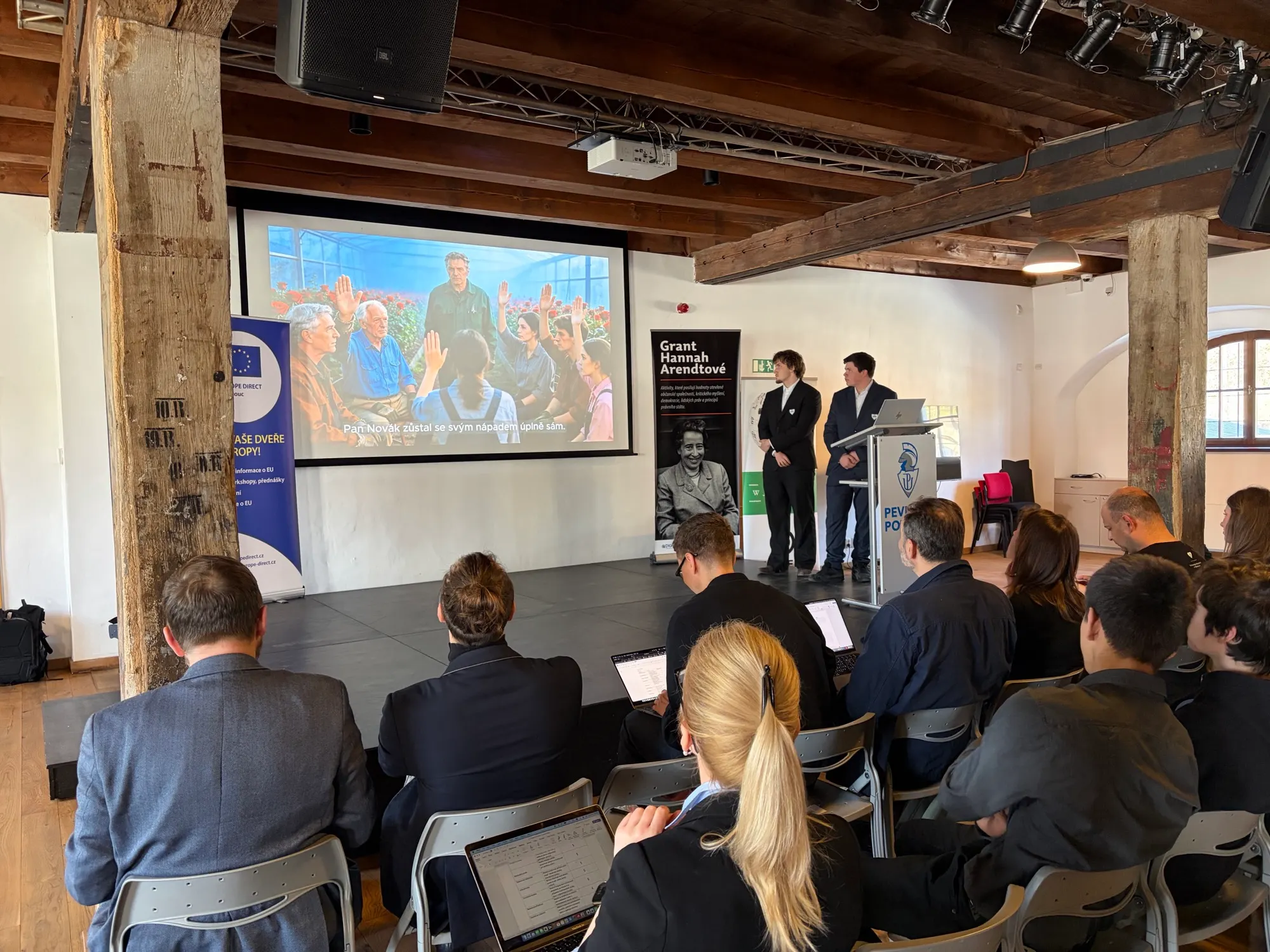 Team presentation in front of a projection screen