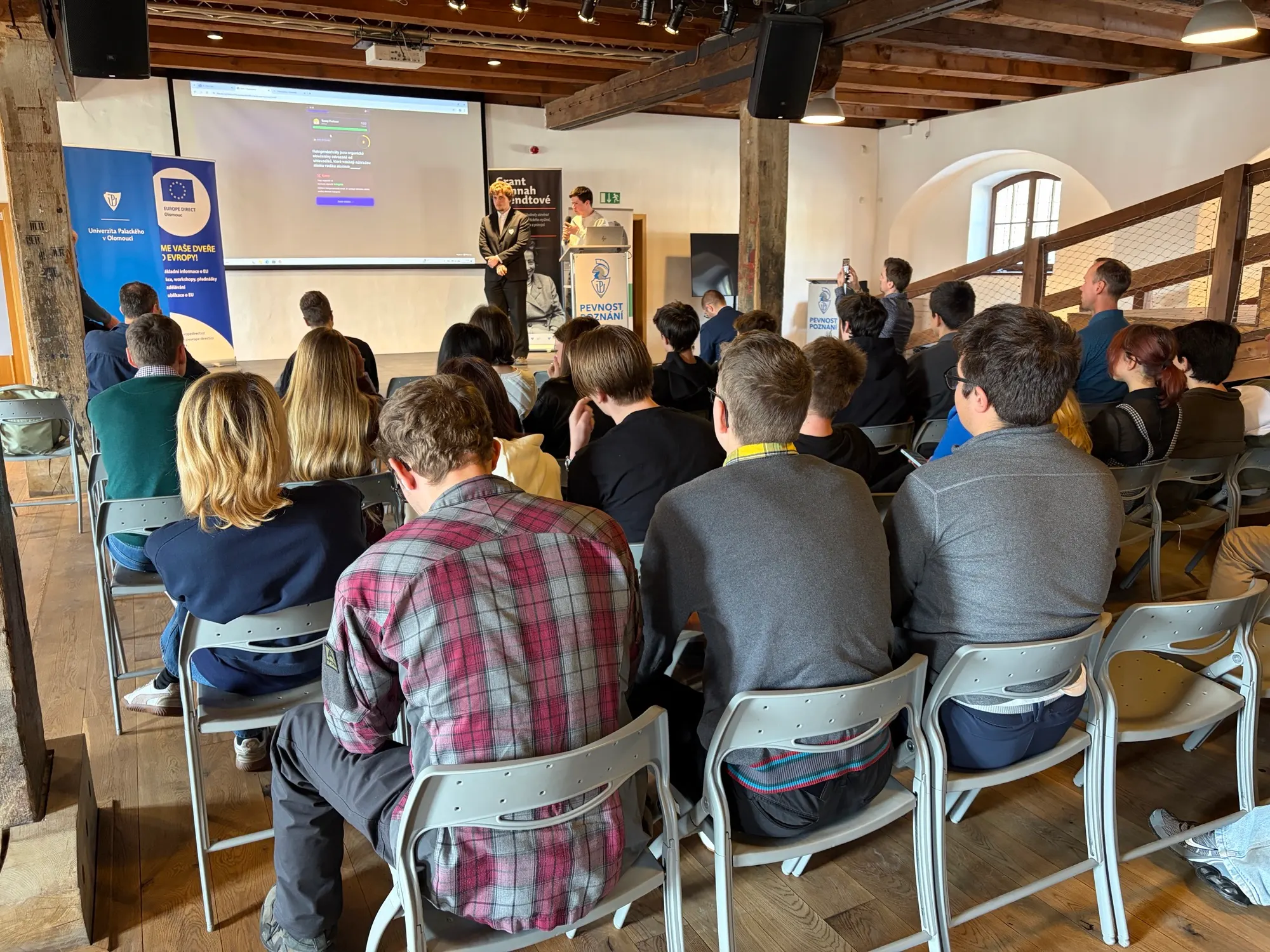 Presentation viewed from the back of the audience